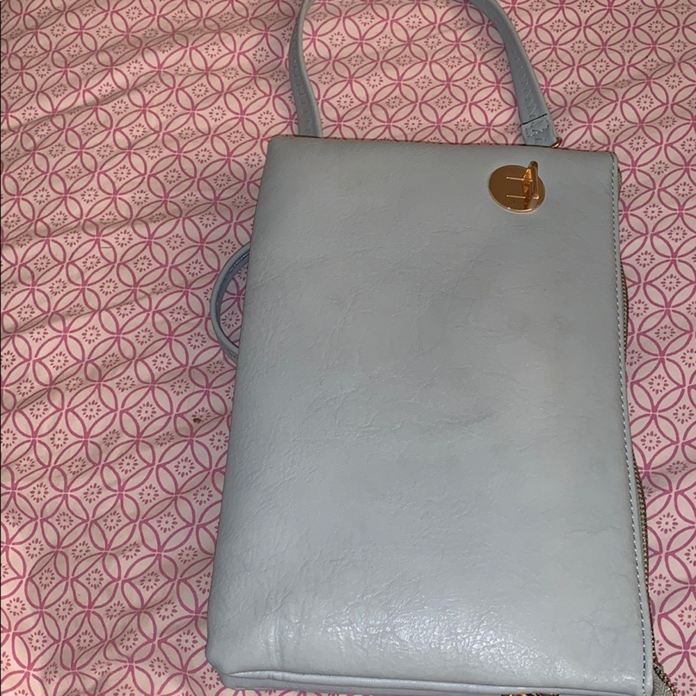 Wristlet purse with a strap